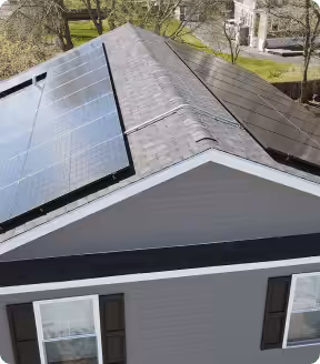 Solar panels installed on a residential roof, showcasing clean energy solutions and home improvement aligned with Massachusetts solar incentives.