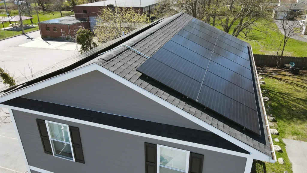 Solar panels installed on a residential roof, showcasing renewable energy solutions in Massachusetts, relevant to state incentives and the SMART program.